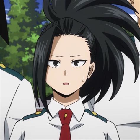 Momo is a tall teenage girl with a mature physique. She has long black hair that is normally tied into a spiky ponytail with a large strand hanging on the right side of her face. Her eyes are big yet sharp, dark in color and paired with short eyebrows set in a determined expression. During school hours, she wears the standard U.A. female uniform.